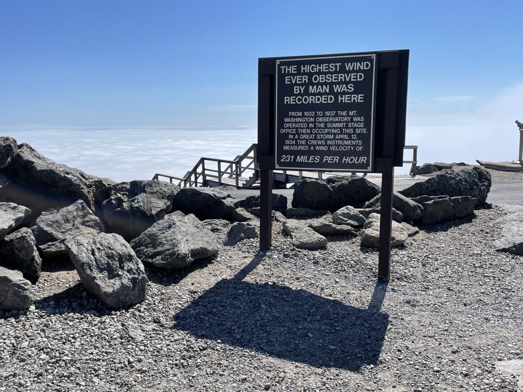 A sign reading The Highest Wind Ever Observed by Man was Recorded Here. 231 miles per hour.