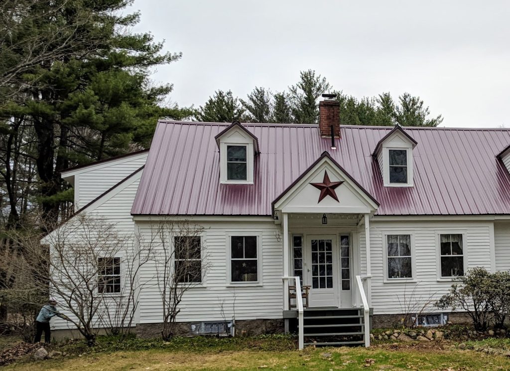 A white home with red roof