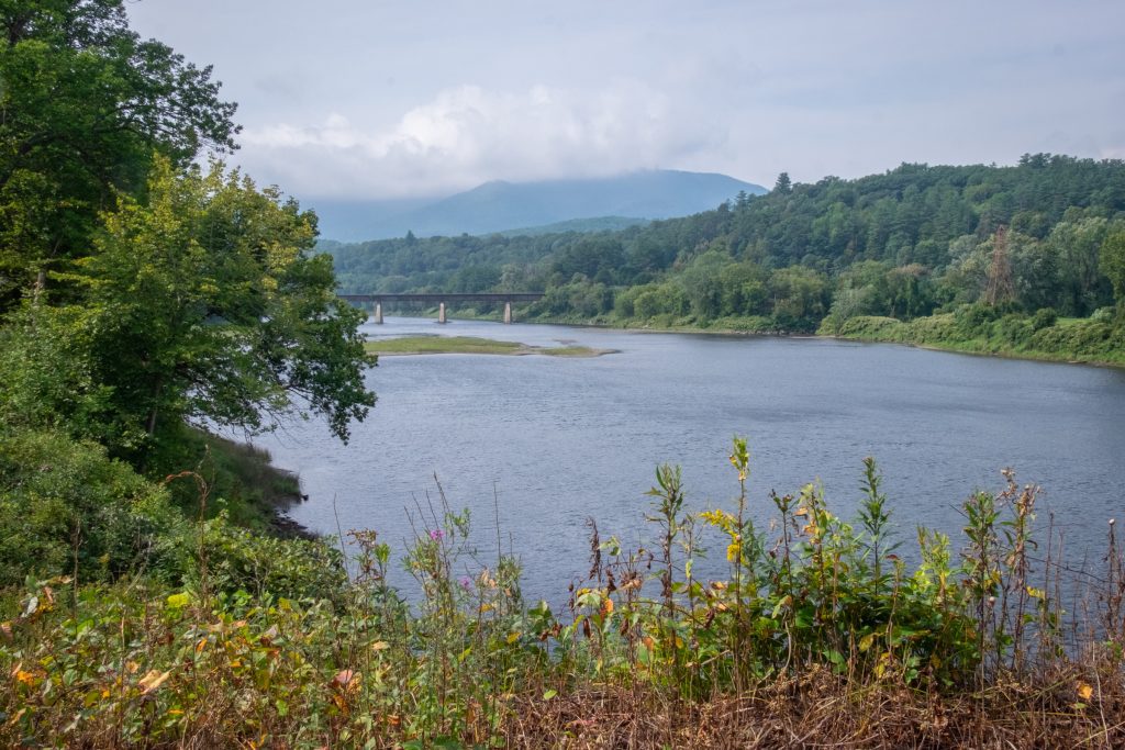 A river surrounded by mountains.